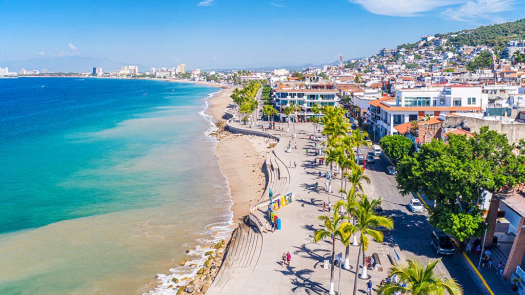 Aerial view of Puerto Vallarta coastline with city buildings and blue ocean